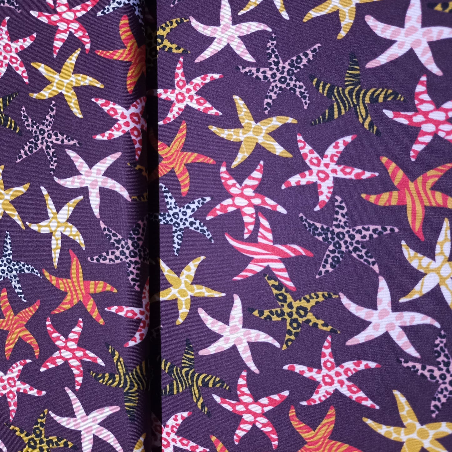 lycra zeesterren op aubergine